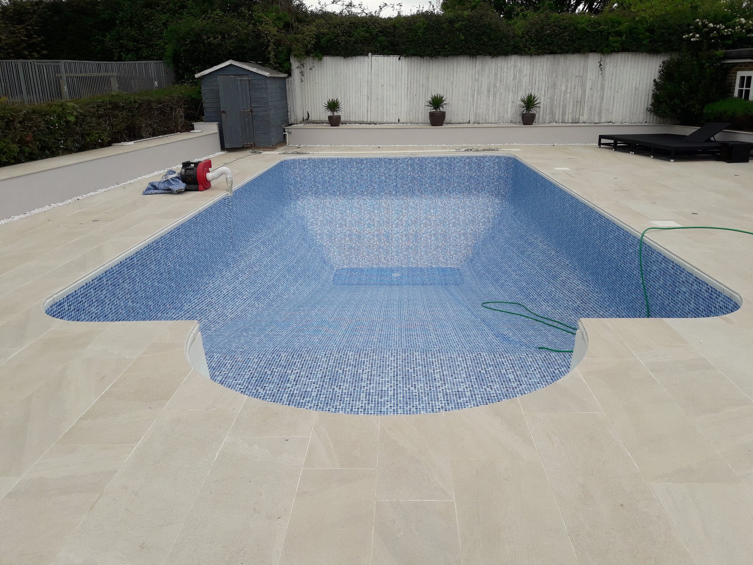 The same pool after refurbishment and new pool tiles