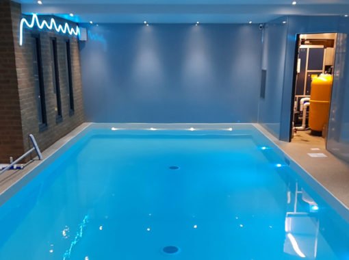 Indoor swimming pool and plant room with decorative lighting