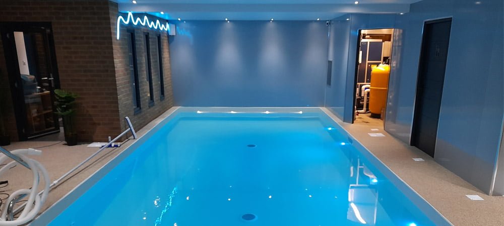 Indoor swimming pool and plant room with decorative lighting