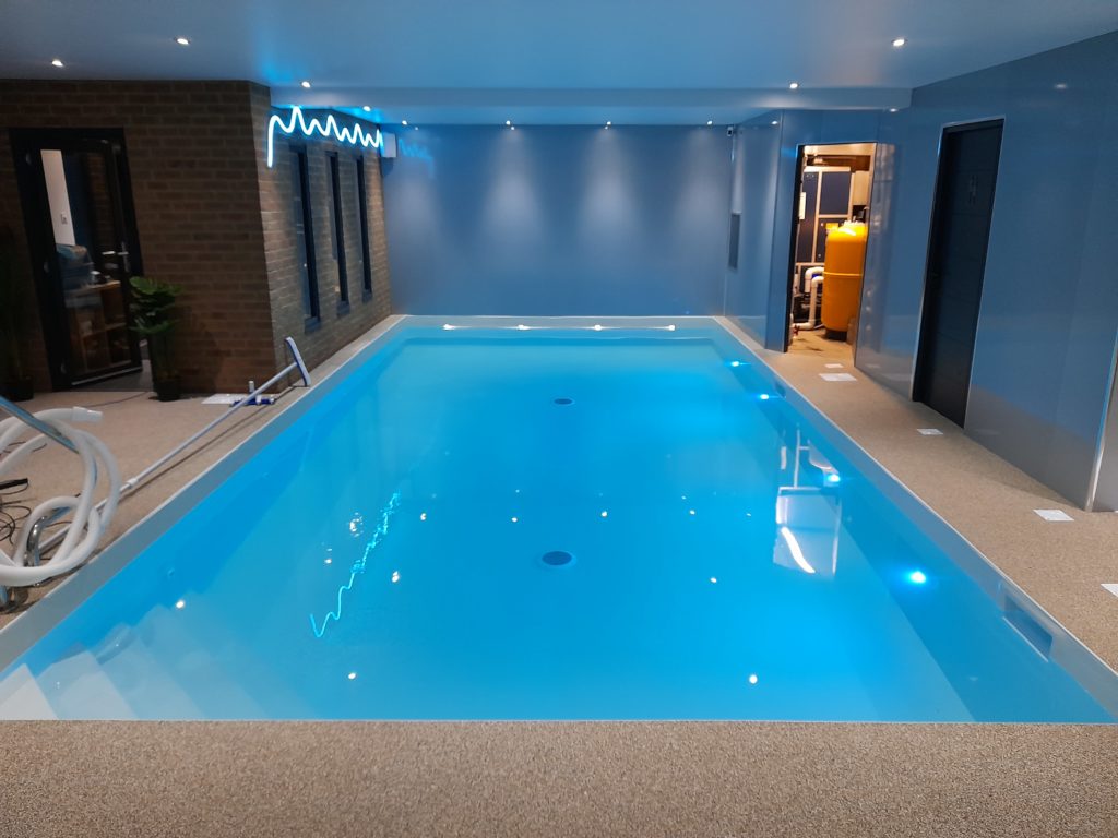 Indoor swimming pool and plant room with decorative lighting