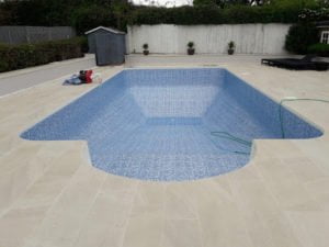 New mosaic pool liner installed on an outdoor swimming pool