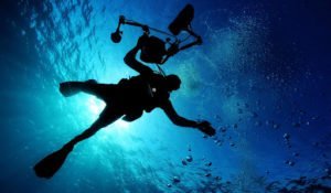 Person scuba diving underwater