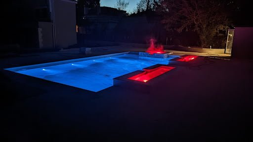 Swimming pool and water features with red lighting