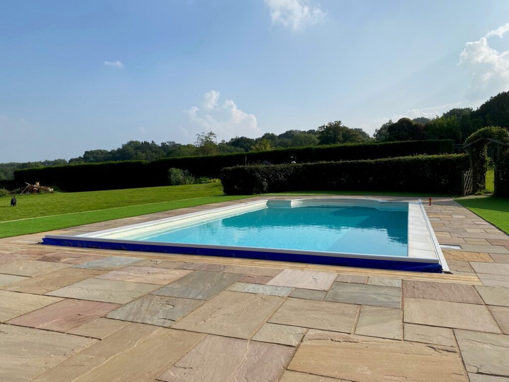 Outdoor swimming pool with patio