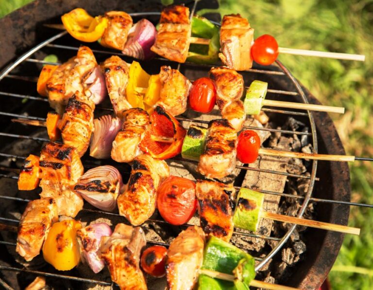 Chicken skewers on a BBQ