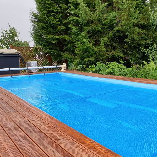 outdoor pool with winter pool cover on