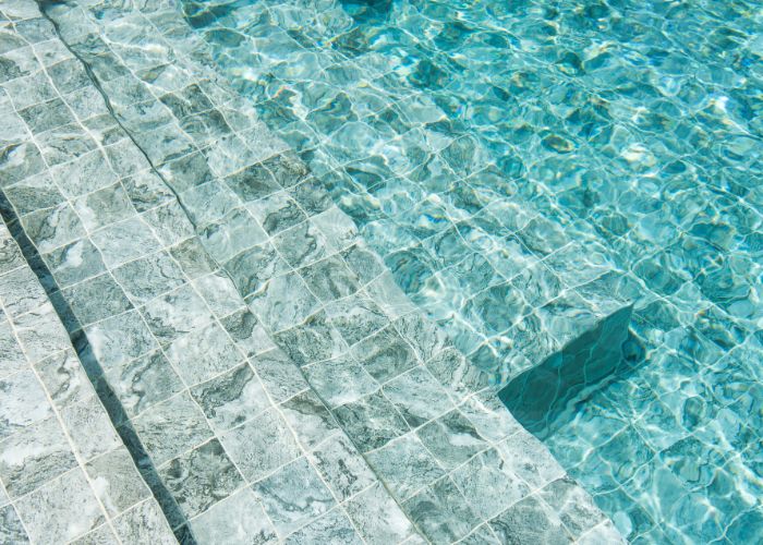 clean swimming pool tiles