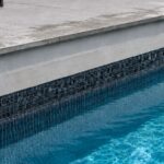 pool water level dropping with damp patio tiles